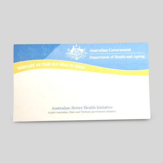 A rectangular notepad featuring the Australian Government Department of Health and Ageing branding. The design highlights the "Medicare 45 Year Old Health Check" initiative with a blue and yellow header. Below, the text mentions the Australian Better Health Initiative, a joint program between Australian, State, and Territory governments. The layout offers ample space for notes, making it both functional and informative.