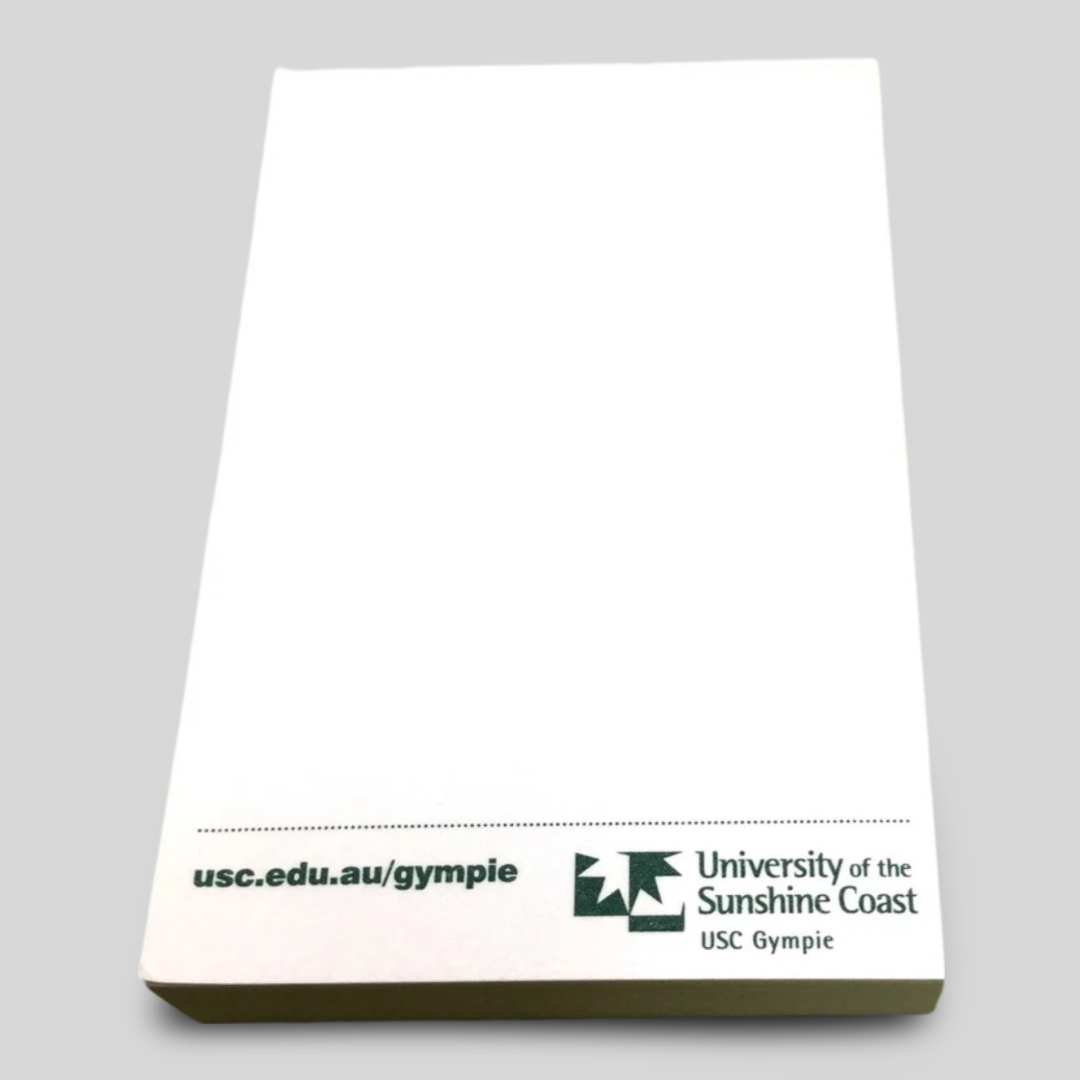 A rectangular notepad branded with the University of the Sunshine Coast (USC Gympie) logo and the website usc.edu.au/gympie printed at the bottom. The design features a clean, professional layout with ample blank space for notes, making it ideal for academic or promotional use.