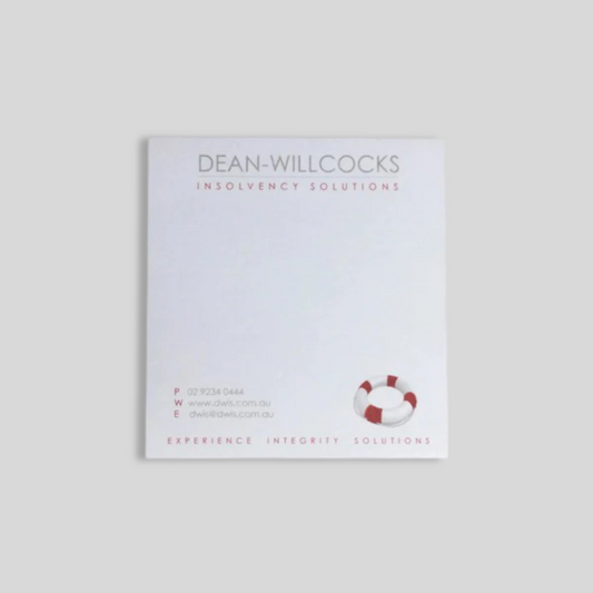 A square notepad featuring the Dean-Willcocks Insolvency Solutions branding. The design includes the company name at the top, contact details at the bottom left, and a small red and white lifebuoy graphic on the lower right. The tagline "Experience. Integrity. Solutions." is printed along the bottom, creating a professional and clean look suitable for corporate use.